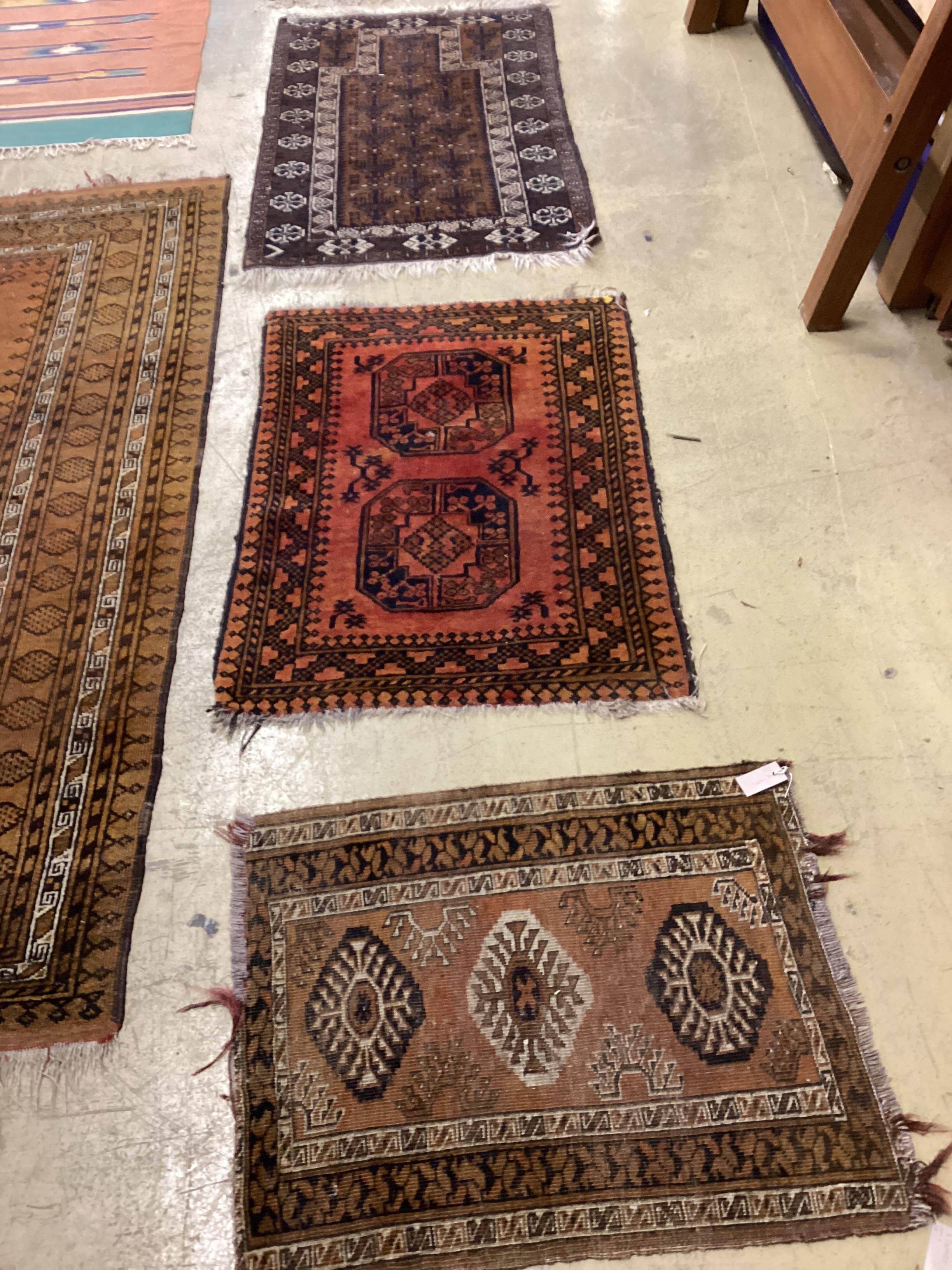 An antique Caucasian rug, an Afghan rug and a Belouch prayer rug, largest 140 x 86cm